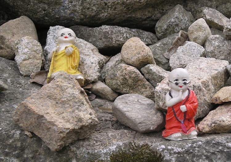 Little Buddhas on a rock, Korean monastery